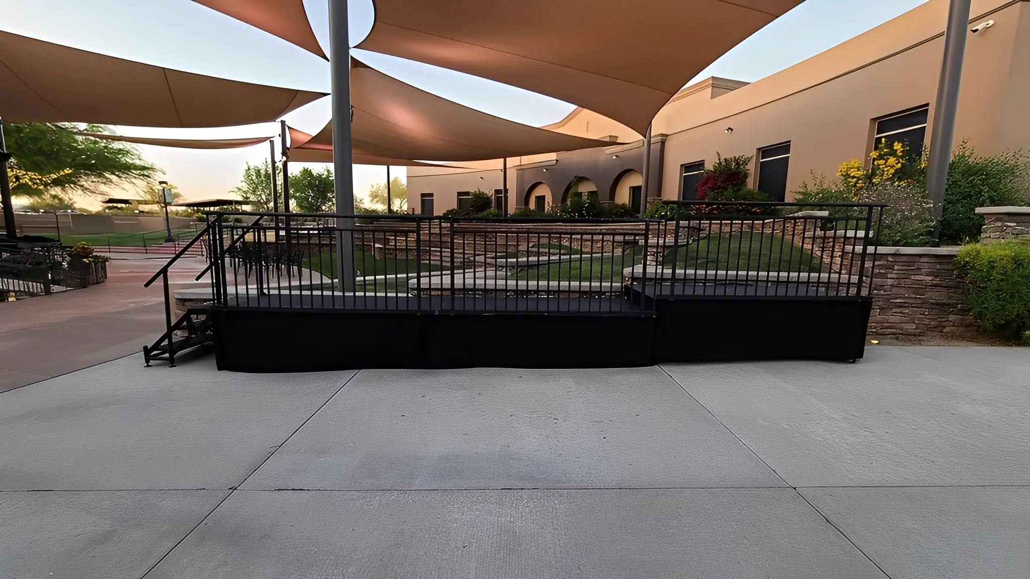Outdoor stage with canopy and seating area.