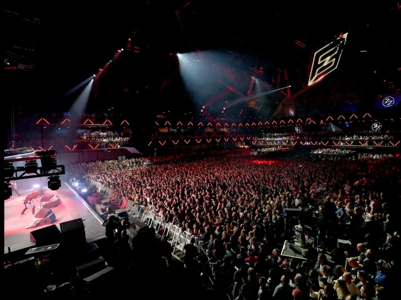 Concert crowd enjoying live music performance.